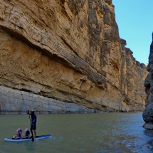 Man with two girls on Rio Grande in the Canyon Santa Elena